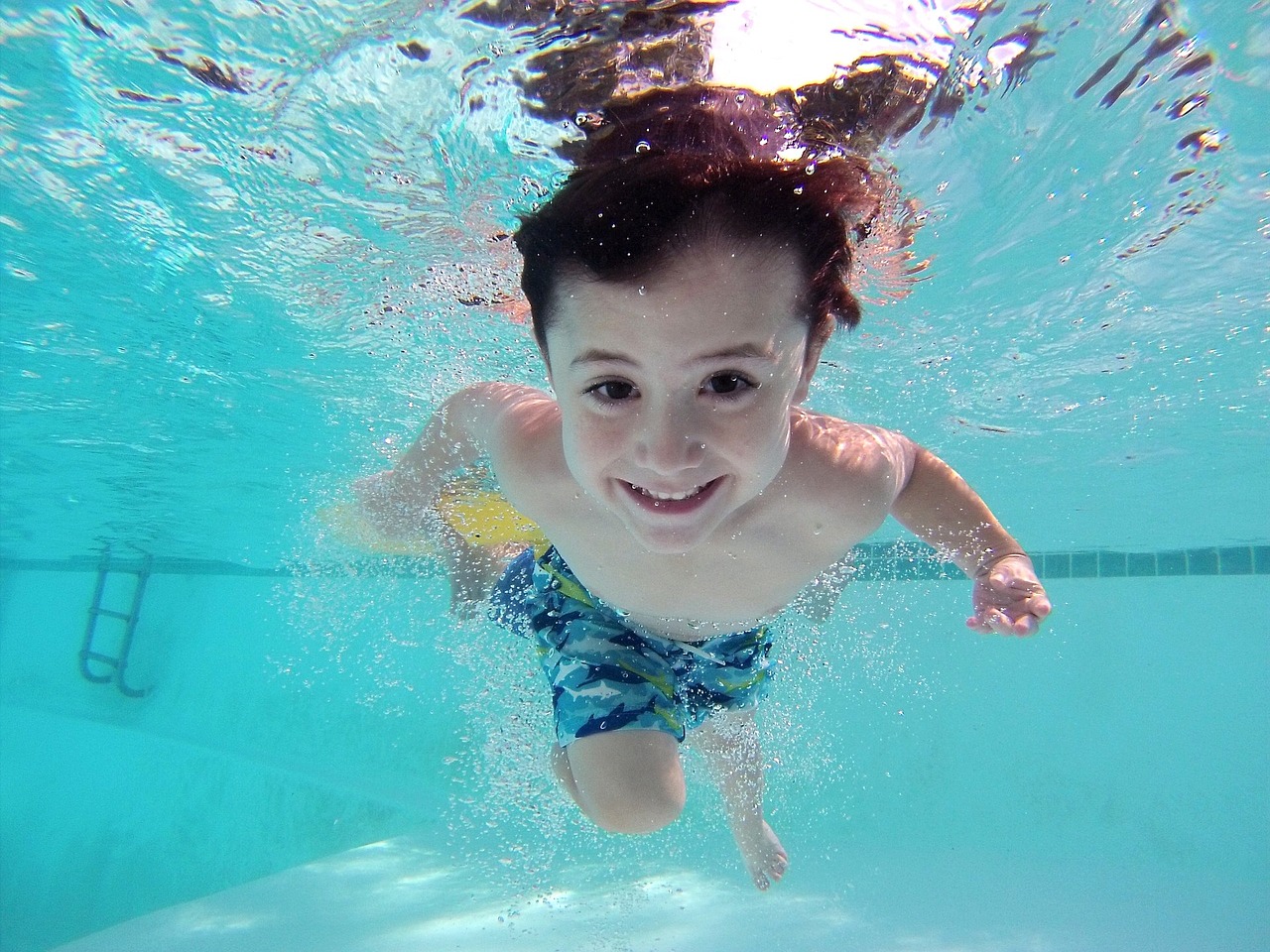 Young boy swimming