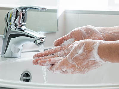 washing hands at sink