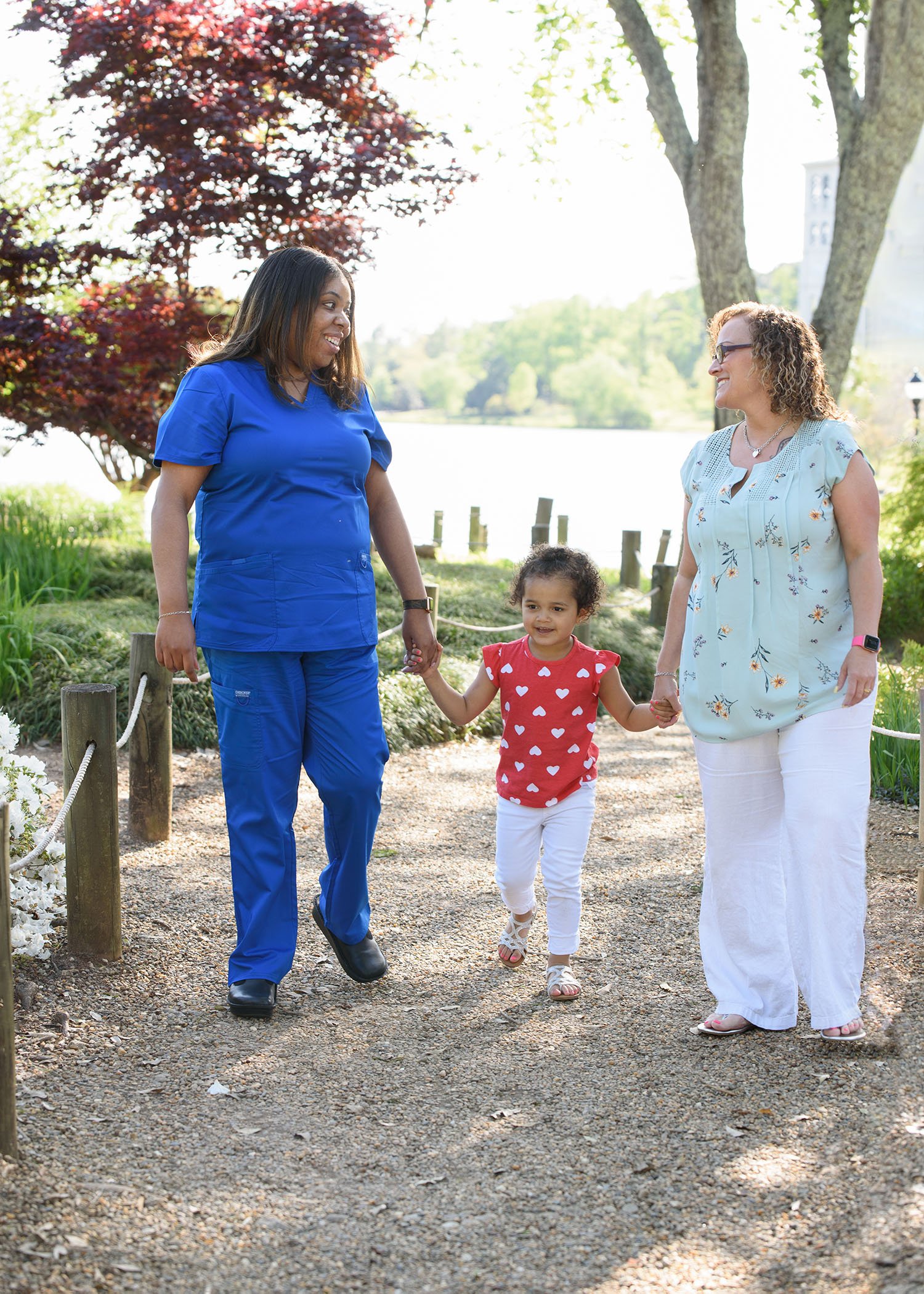 NFP nurse visiting with client and toddler in park