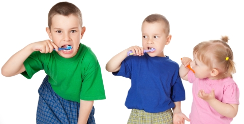 2 boys & girl brushing teeth