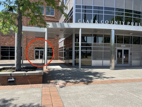 Front of the Public Services Building, with a red circle around the Probation-Pretrial Services doors