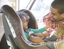placing-child-in-car-seat.jpg