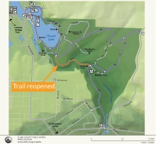 Map of Lacamas Regional Park trail system, with part of the trail highlighted orange and a note reading "Trail Reopened" pointing to the highlighted trail portion.